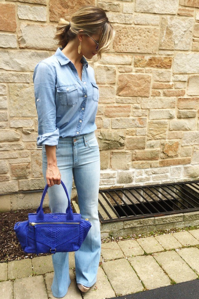 Denim on denim, wedges, and blue handbag