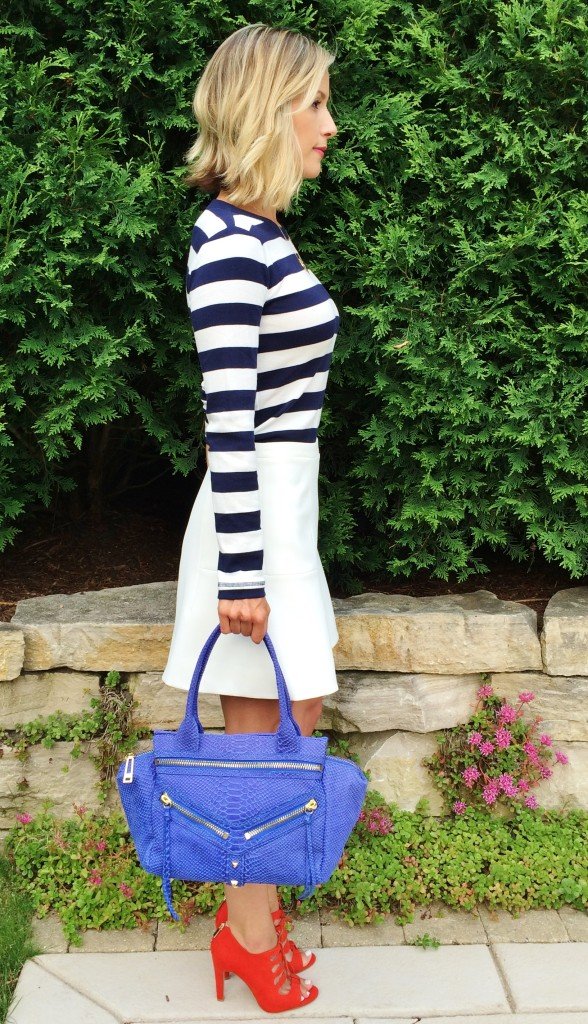 Patriotic outfit: navy striped tee, white skirt, blue bag, red heels