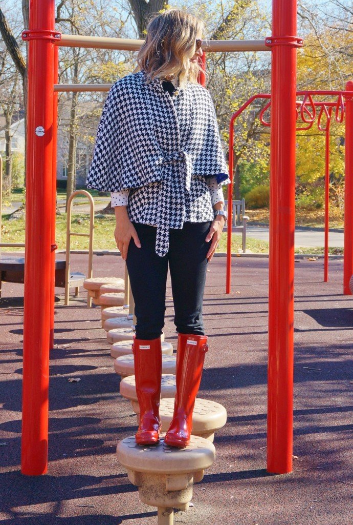 Houndstooth poncho, leggings, and red rain boots