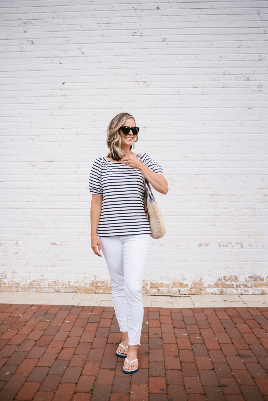 Striped tee, white denim, flip flops, sunglasses, and tote