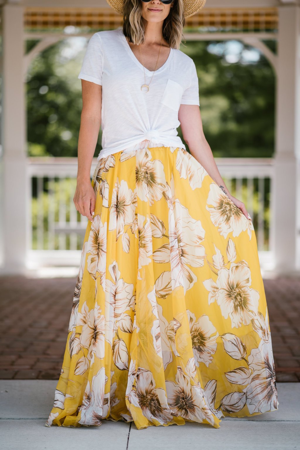 Summer style: floral maxi skirt, white tee, straw hat, sunglasses, sandals