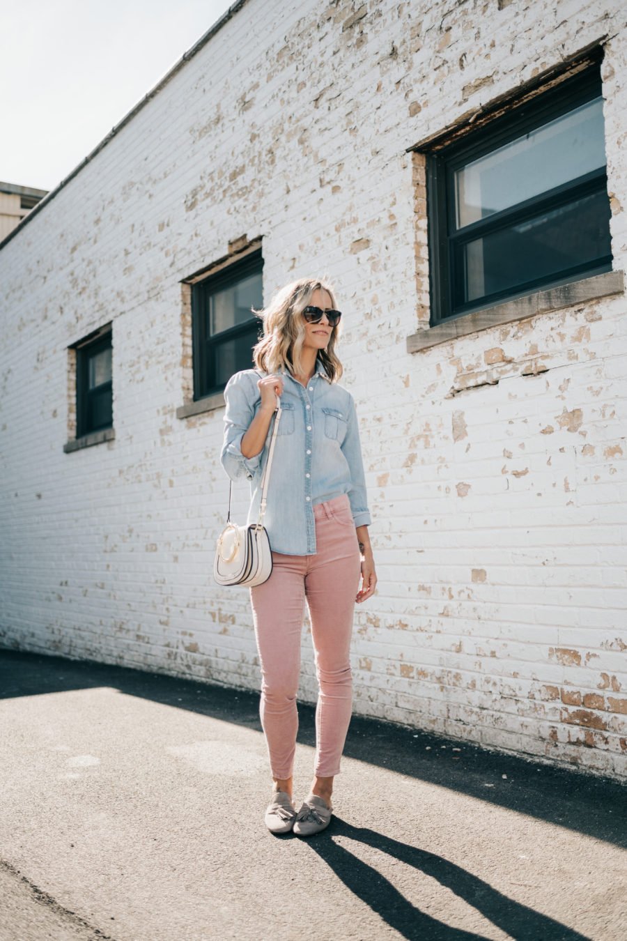 Denim shirt, pink jeans, Chloe dupe bag, sunglasses, and mules
