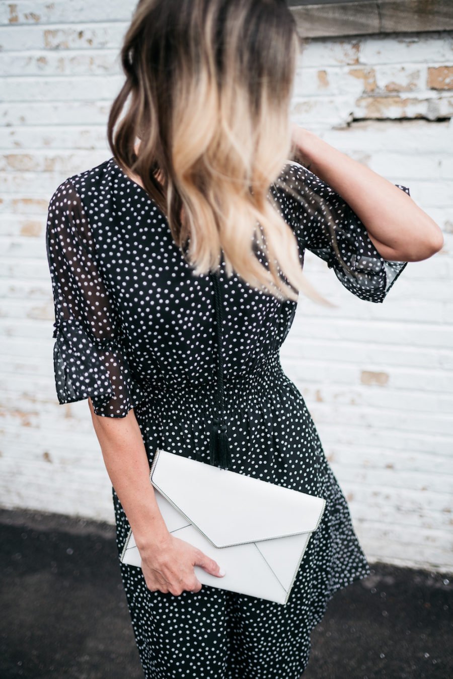 polka dots and ruffle spring dress, white clutch, black heels