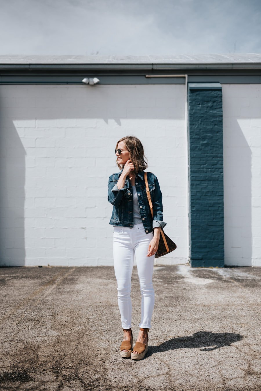 White jeans, grey tank, espadrilles, denim jacket, Louis Vuitton bag, sunglasses