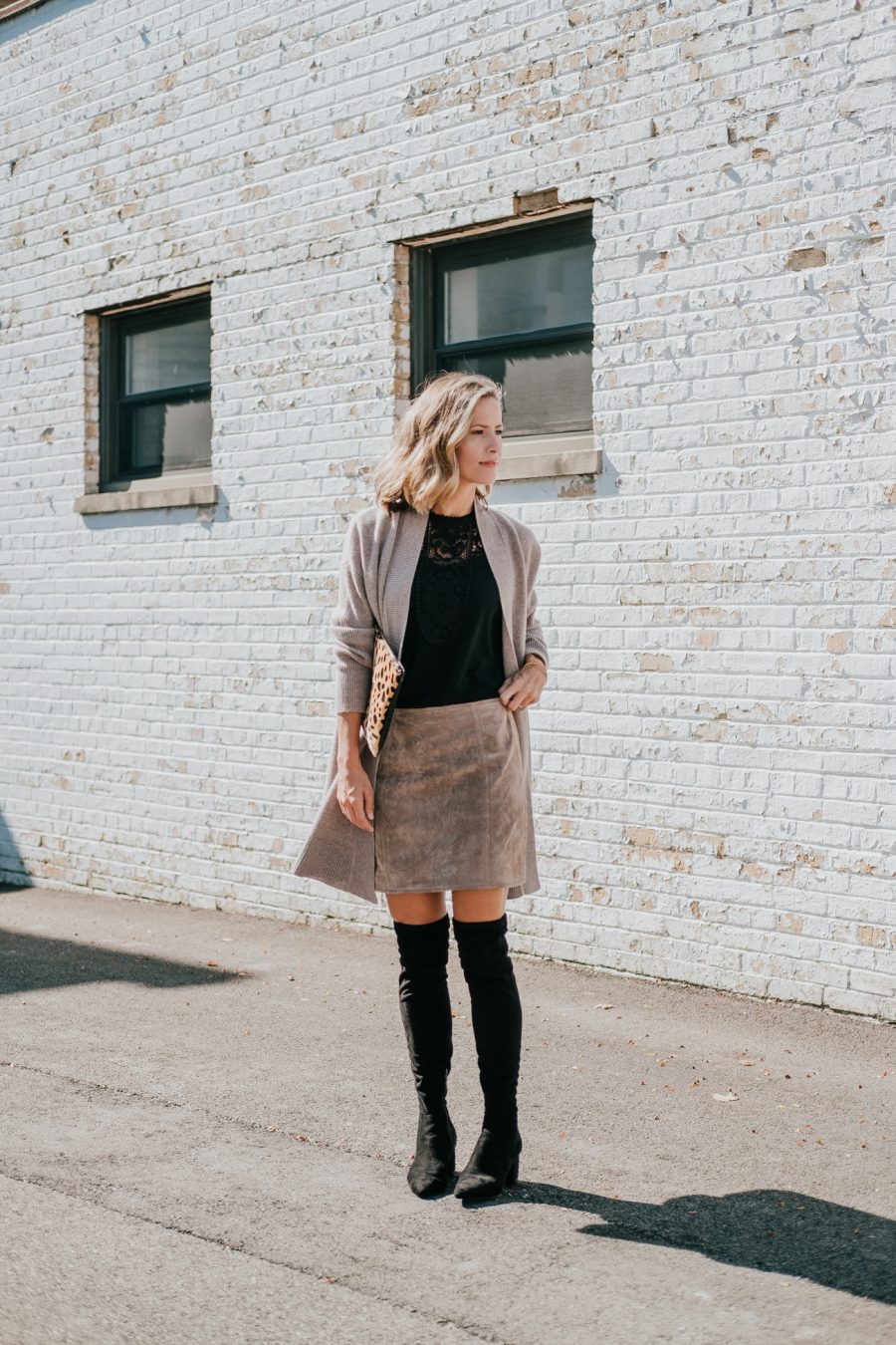 Cardigan, black top, brown suede skirt, leopard bag, over the knee boots