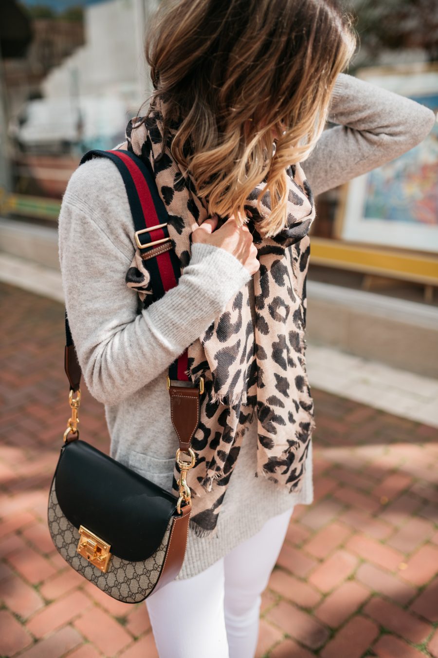 White denim for fall, grey sweater, leopard scarf, cross body bag, booties