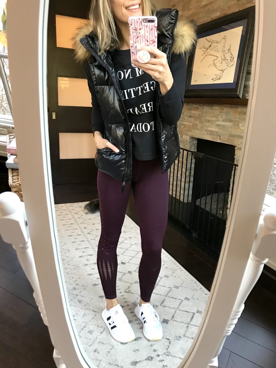 Black puffer vest, sweatshirt, leggings and sneakers