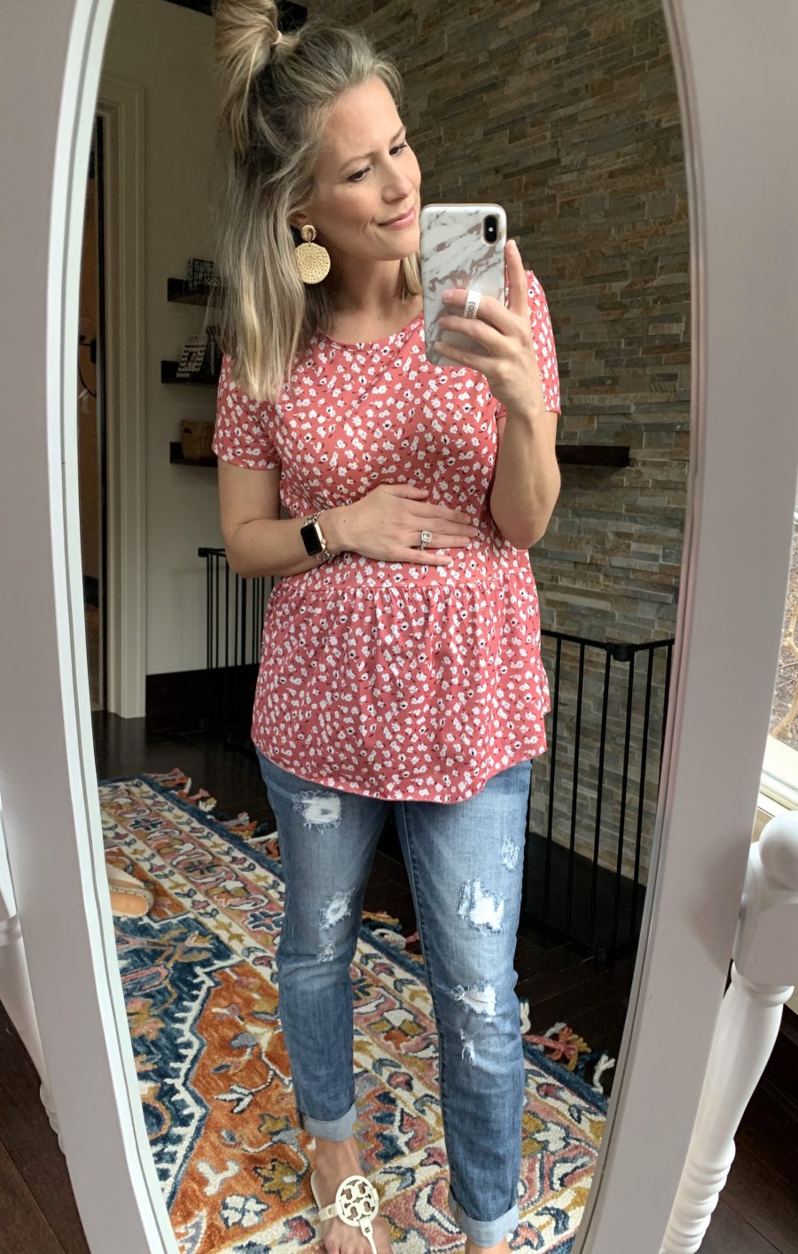 Floral top, denim, and straw earrings