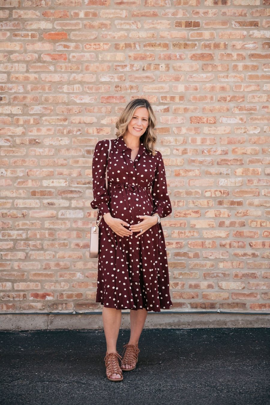 Maternity style: polka dot shirt dress, cross body bag, and sandals