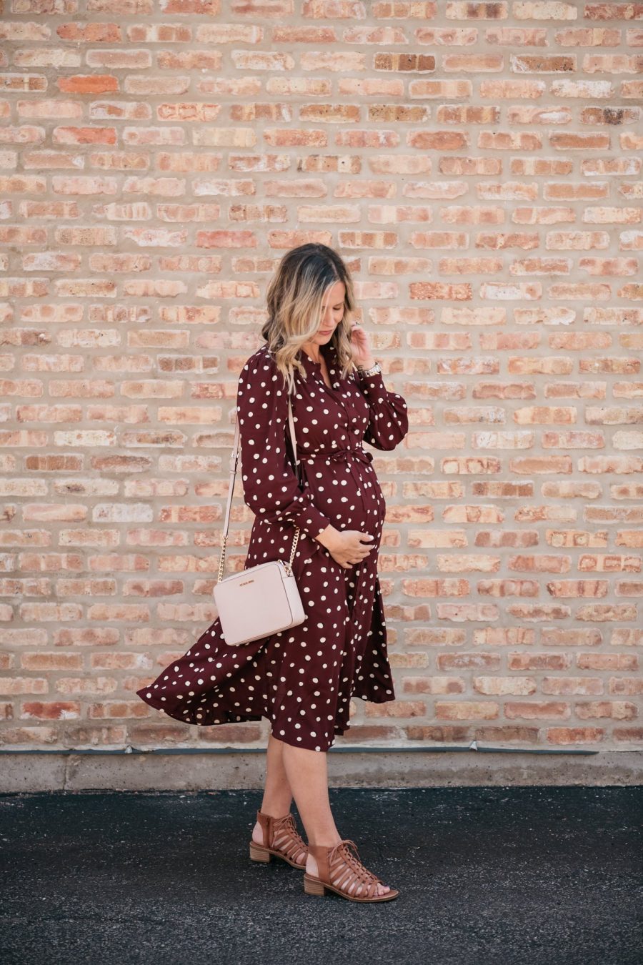 Maternity style: polka dot shirt dress, cross body bag, and sandals