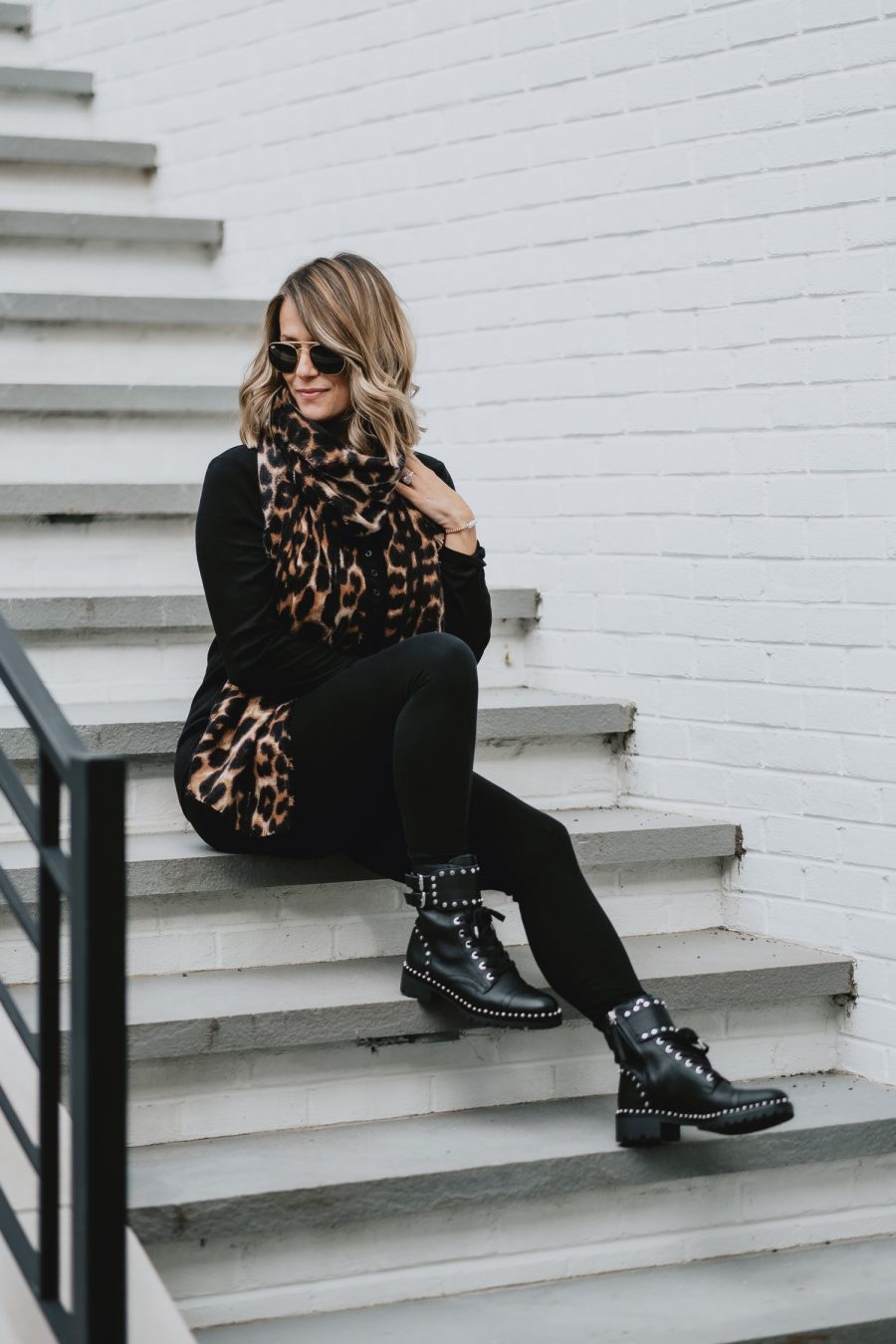 Edgy outfit ideas--all black with leopard scarf and combat boots