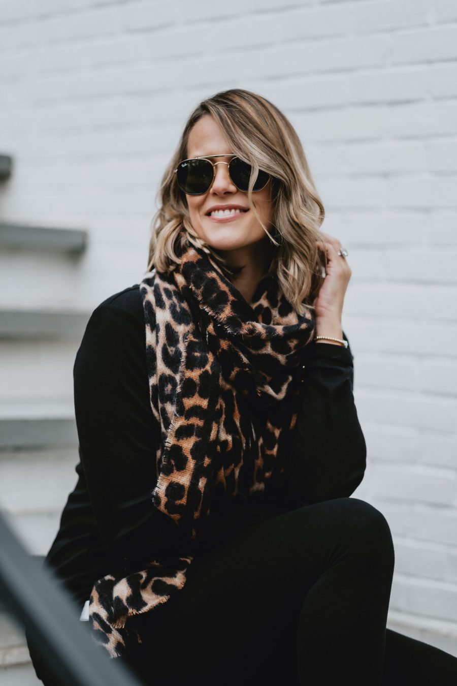 Edgy outfit ideas--all black with leopard scarf and combat boots