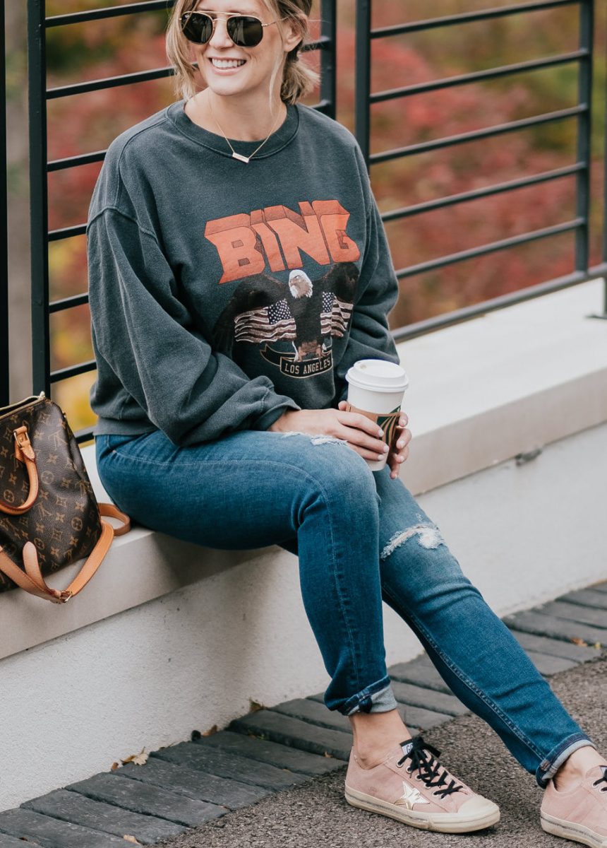 Postpartum casual outfit: sweatshirt, jeans, and sneakers