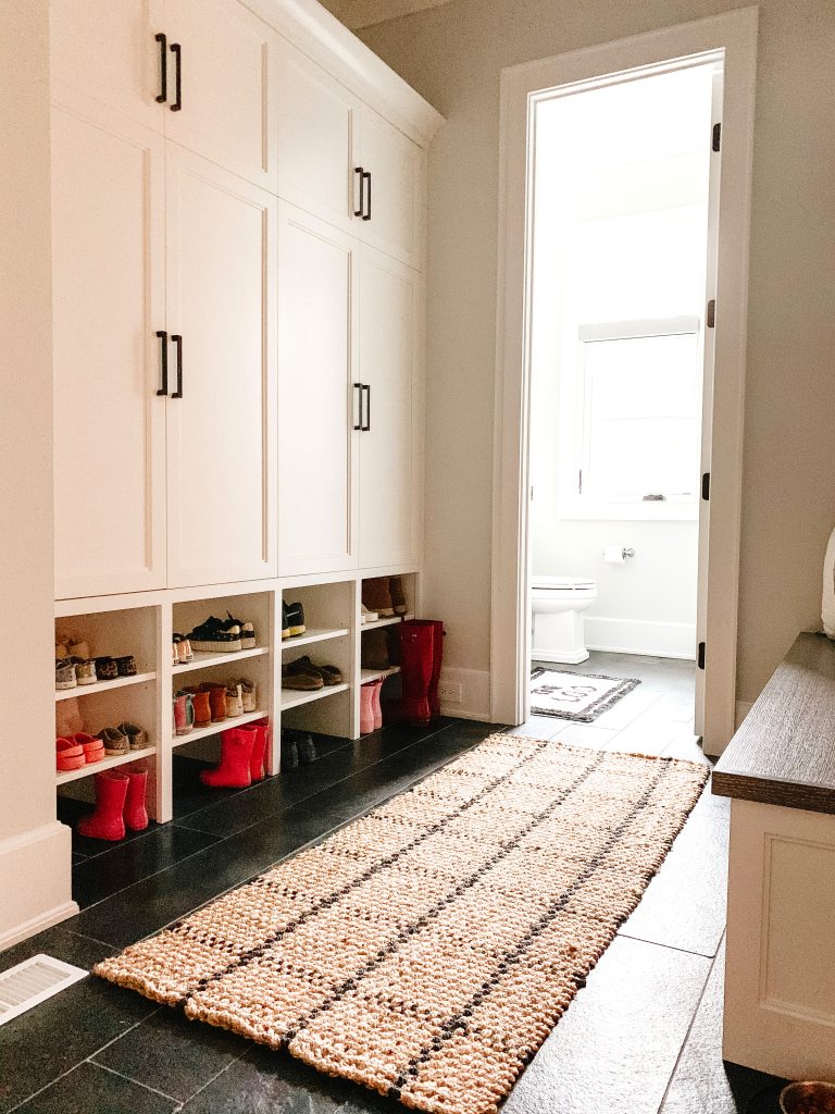I'm sharing a glimpse into our mudroom and my favorite baskets, hooks, and bins to keep the space organized and give easy access to the kids.