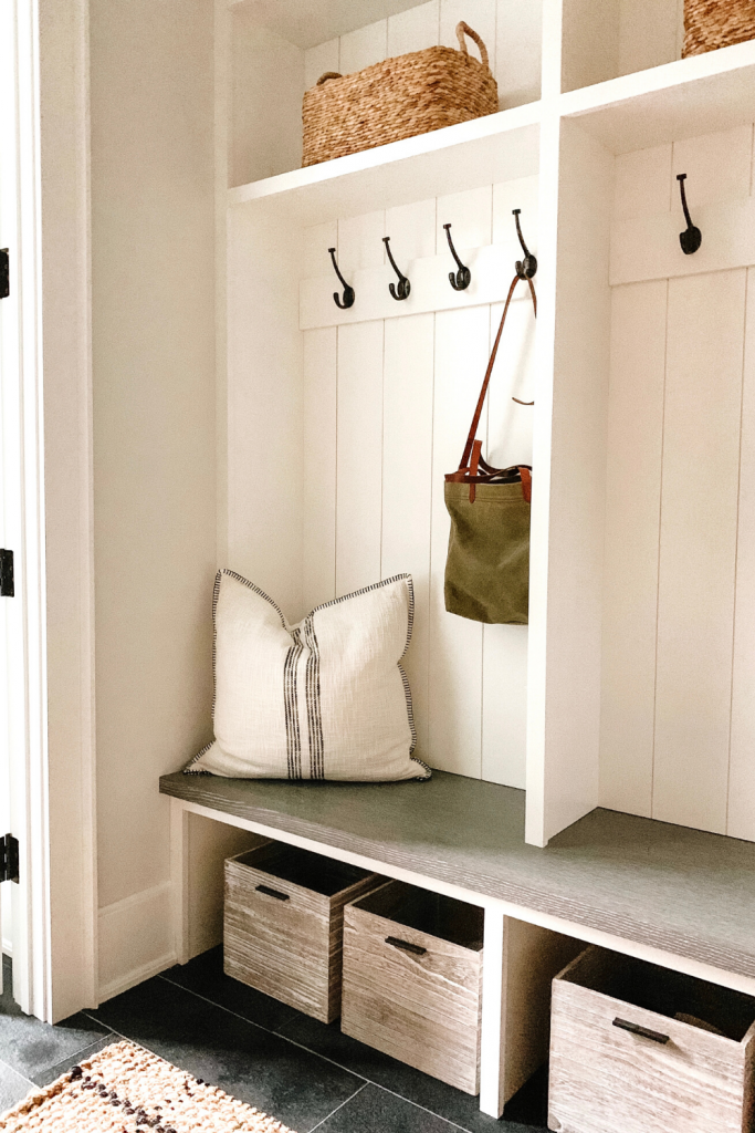 I'm sharing a glimpse into our mudroom and my favorite baskets, hooks, and bins to keep the space organized and give easy access to the kids.