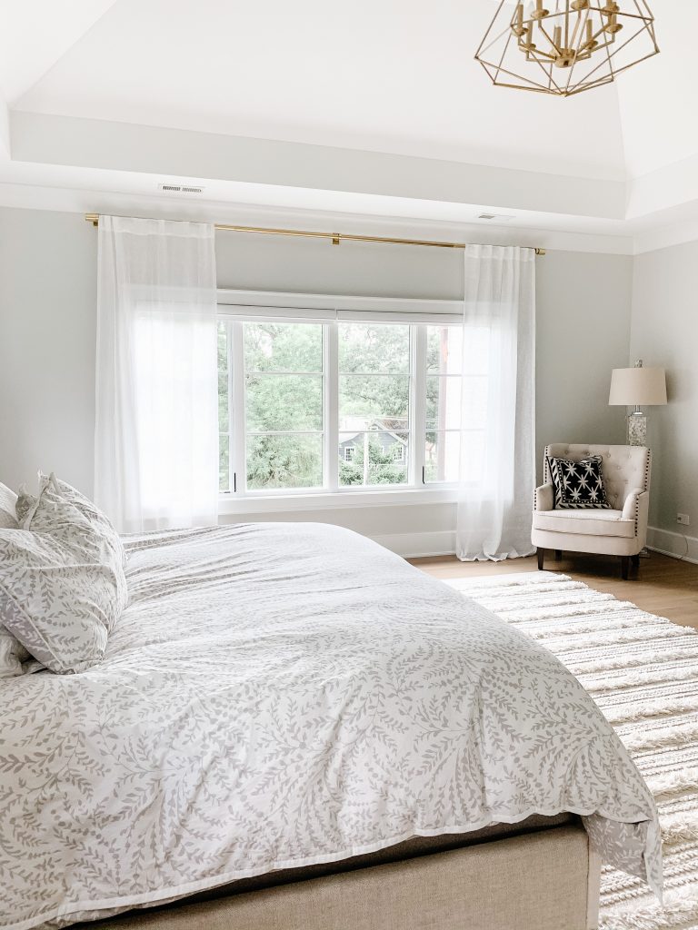 I'm sharing our cozy and neutral master bedroom complete with new curtains, comfy bedding, a floor length mirror, and the Samsung tv frame. 