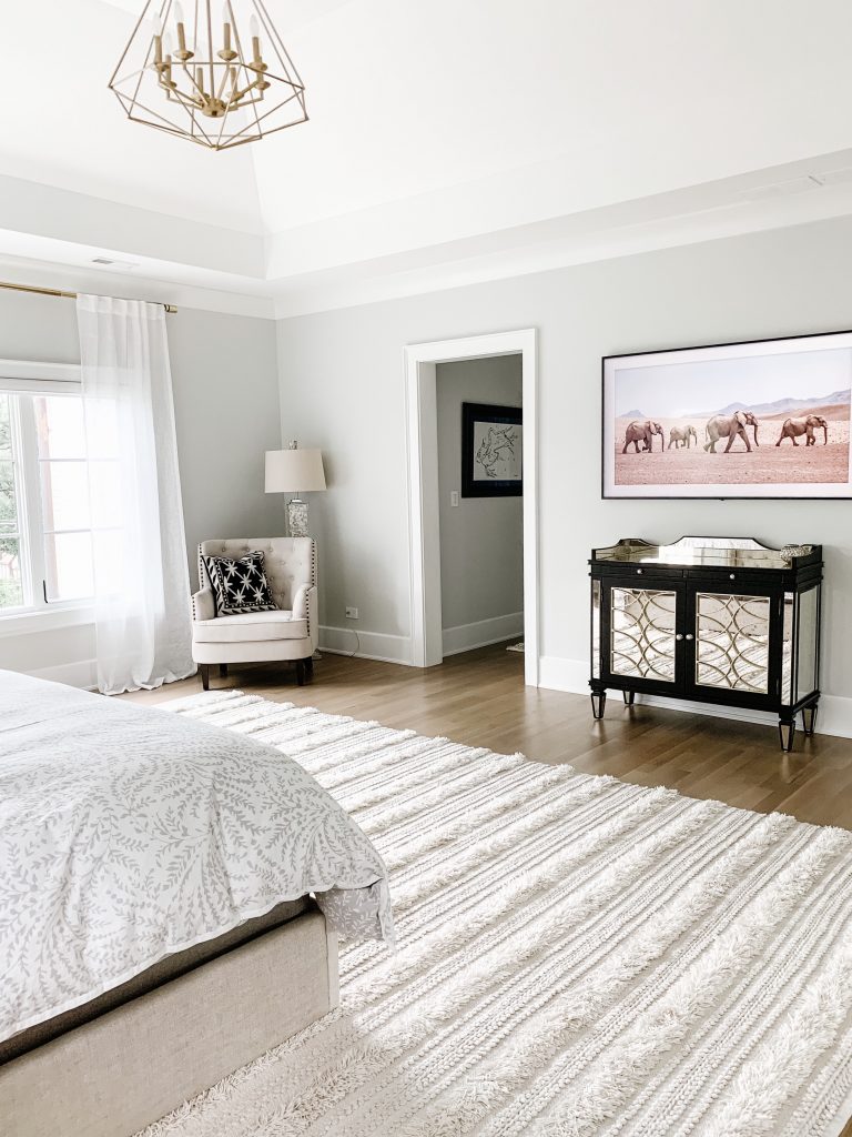 I'm sharing our cozy and neutral master bedroom complete with new curtains, comfy bedding, a floor length mirror, and the Samsung tv frame. 