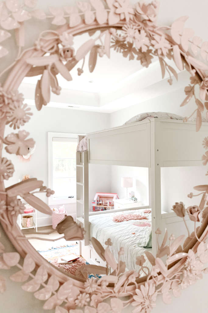 Transition to a big girl bedroom with bunkbeds, vibrant pops of color, and a cozy reading area.