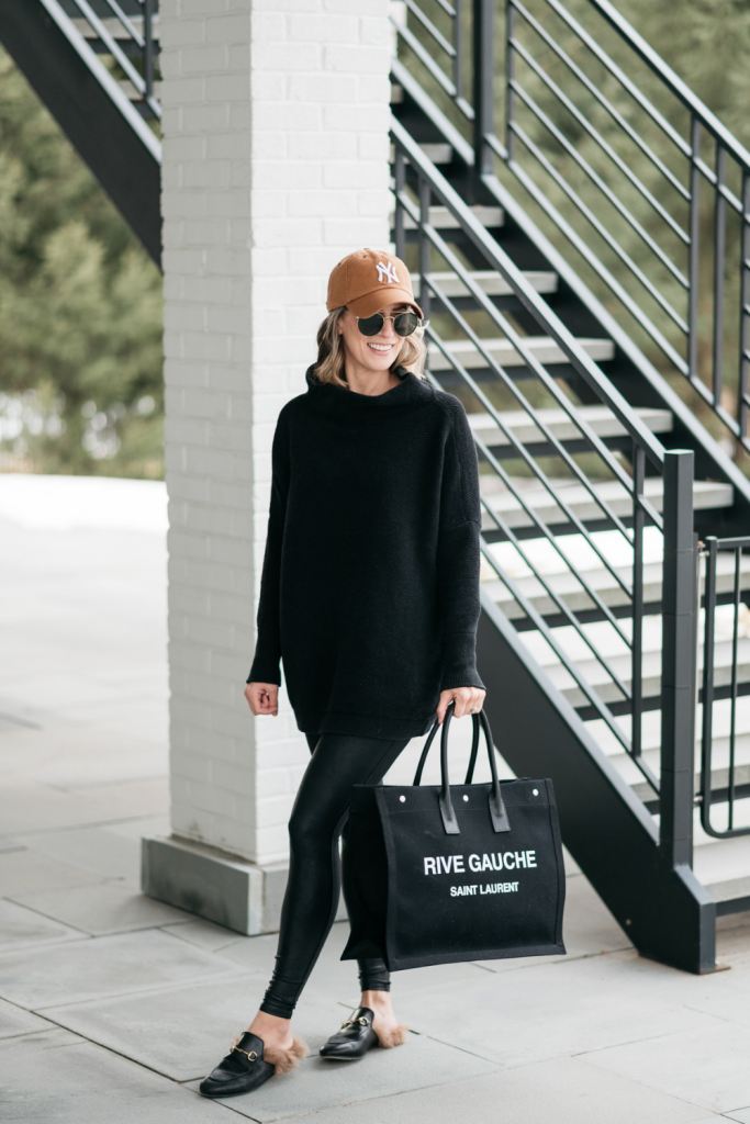 How to style a cozy black Free People tunic with black faux leather Spanx leggings and mules.  