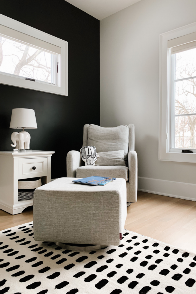Revealing Baby Gray's nursery featuring a printed accent wall to pop against the minimalistic and sleek furniture and decor.