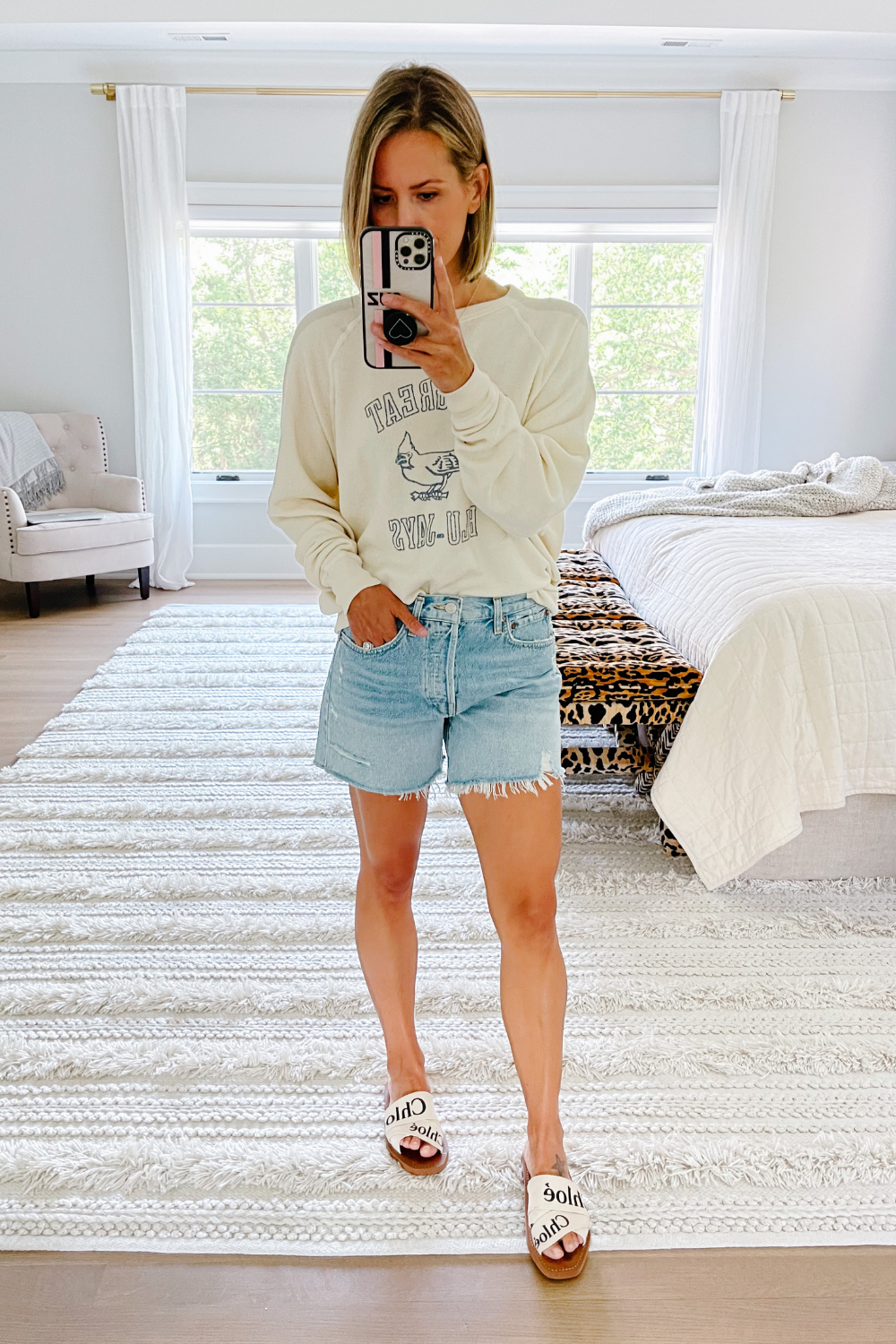 Summer to fall style: sweatshirt and denim shorts