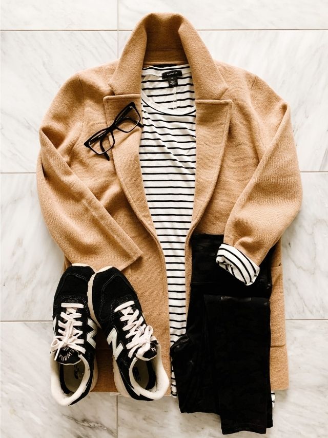 A flat lay of an outfit idea styling a sweater blazer