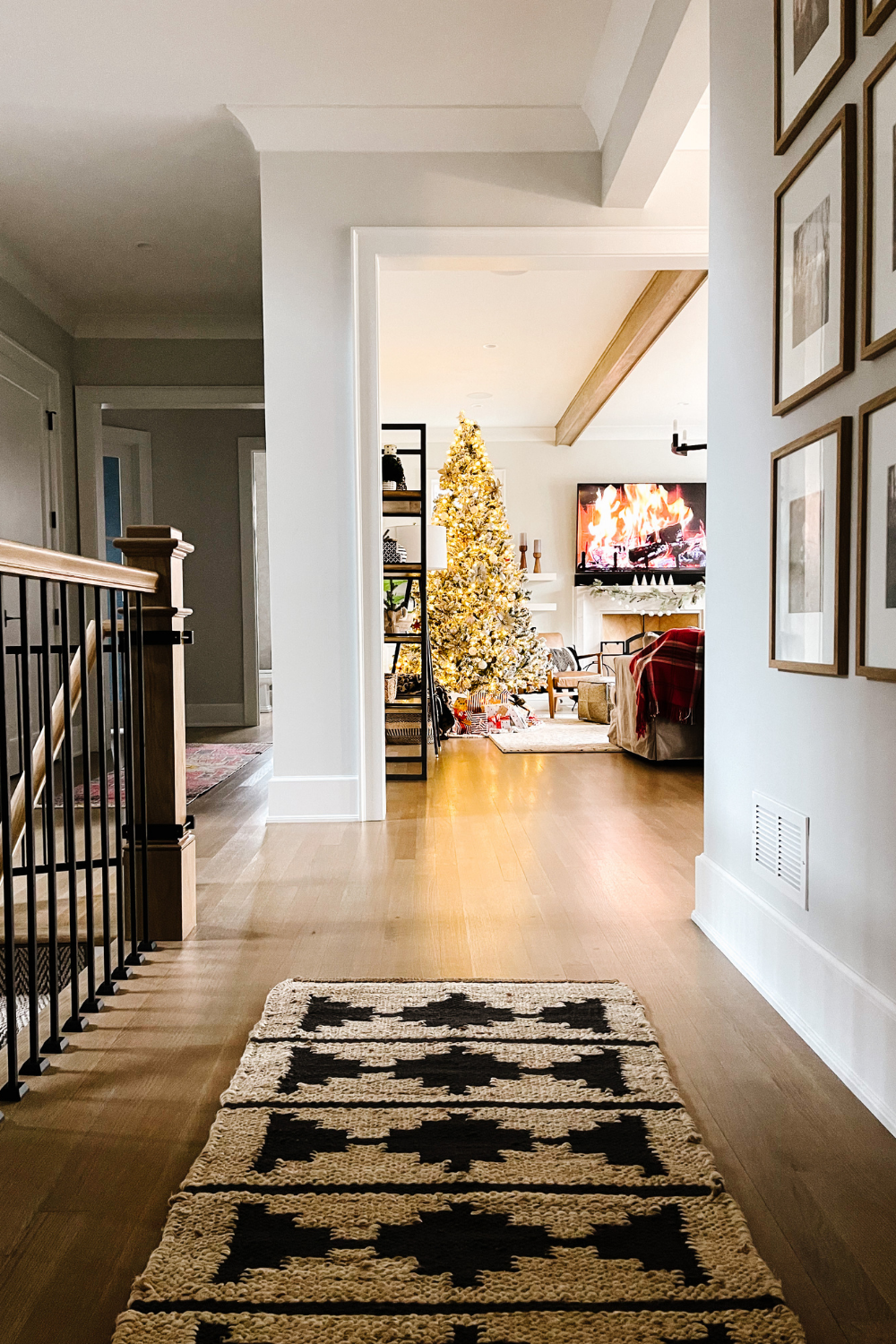 Entryway leading to the family room with a flocked Chrismas tree