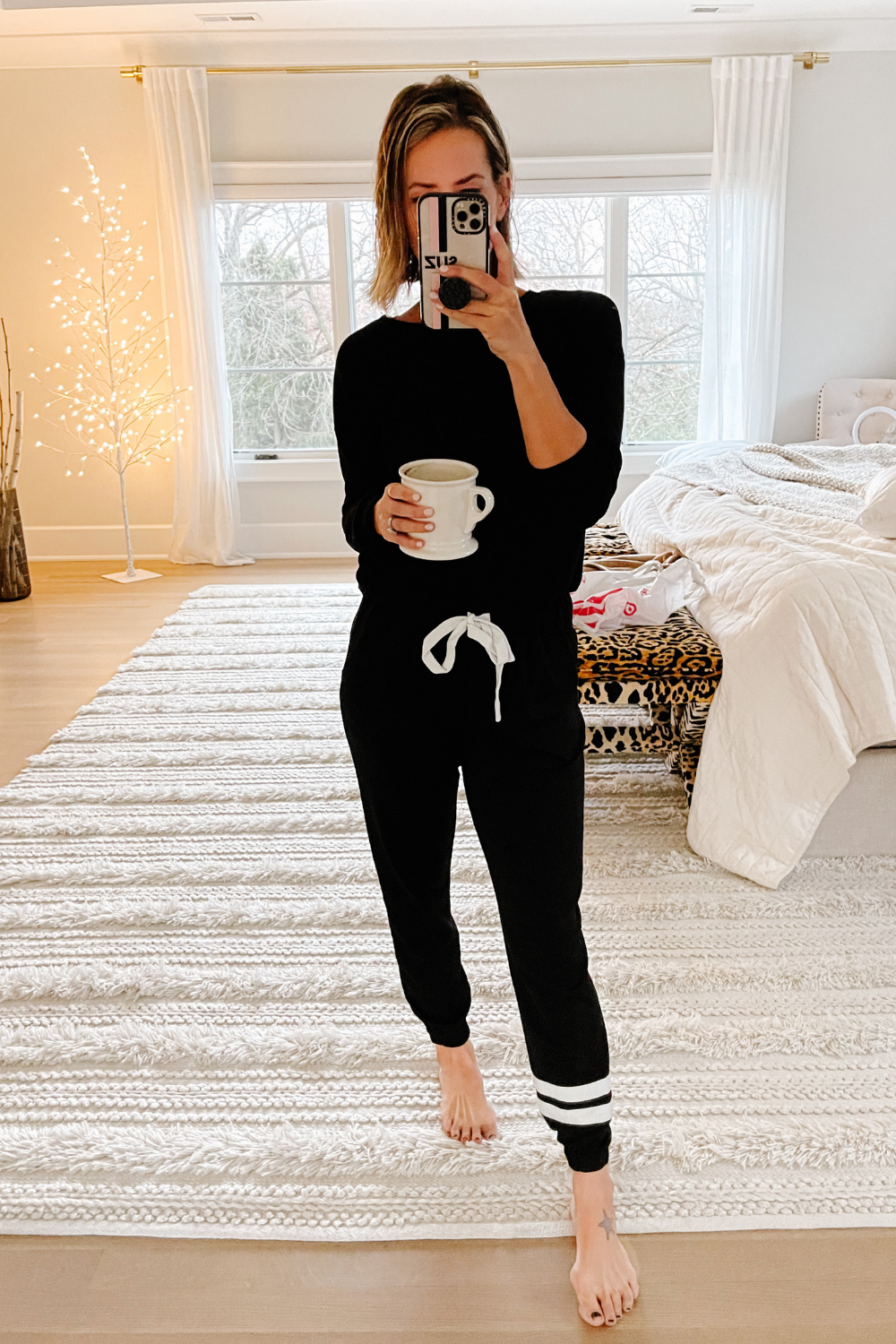 Suzanne wearing a black jogger set