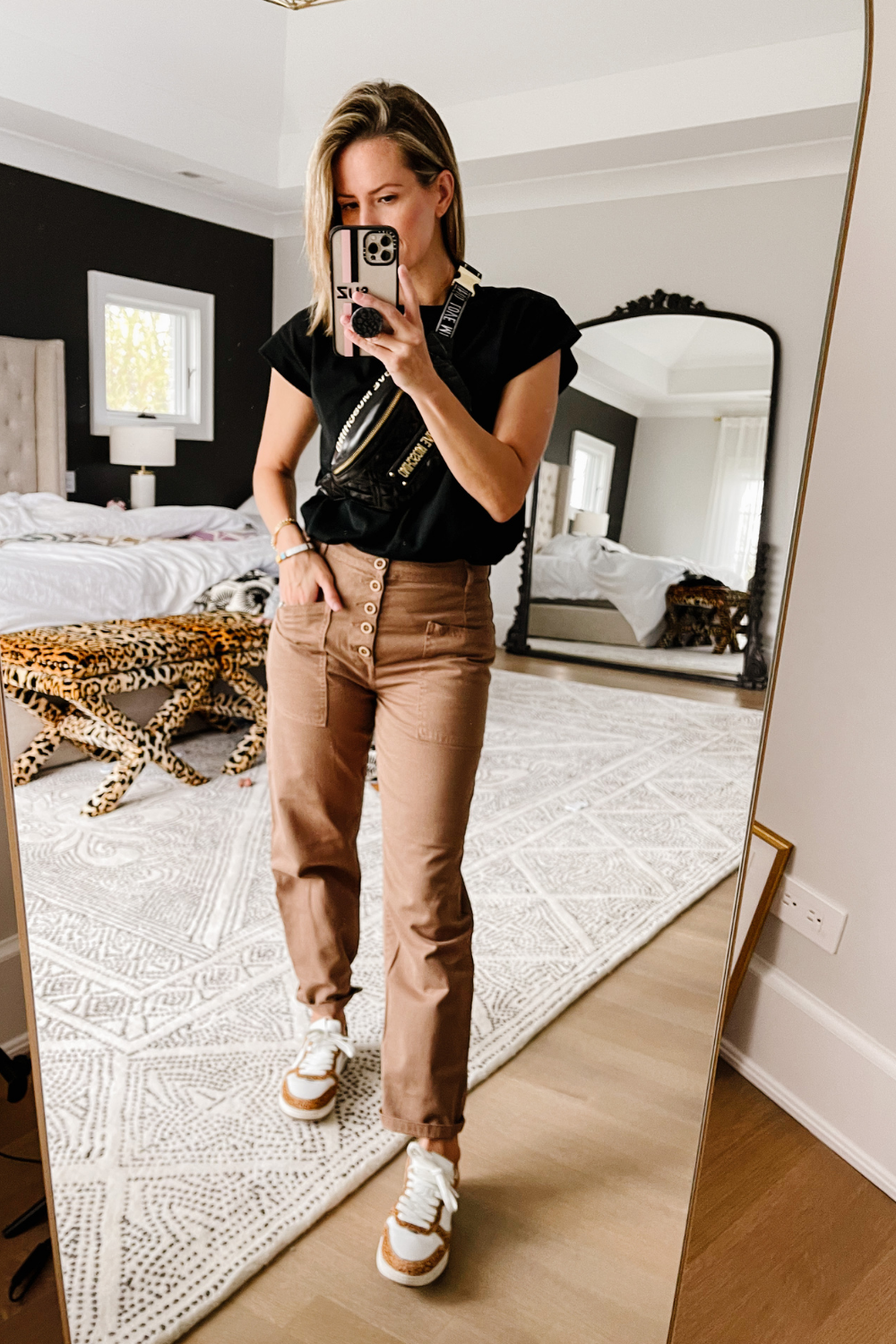 Suzanne wearing Pistola trousers and sneakers