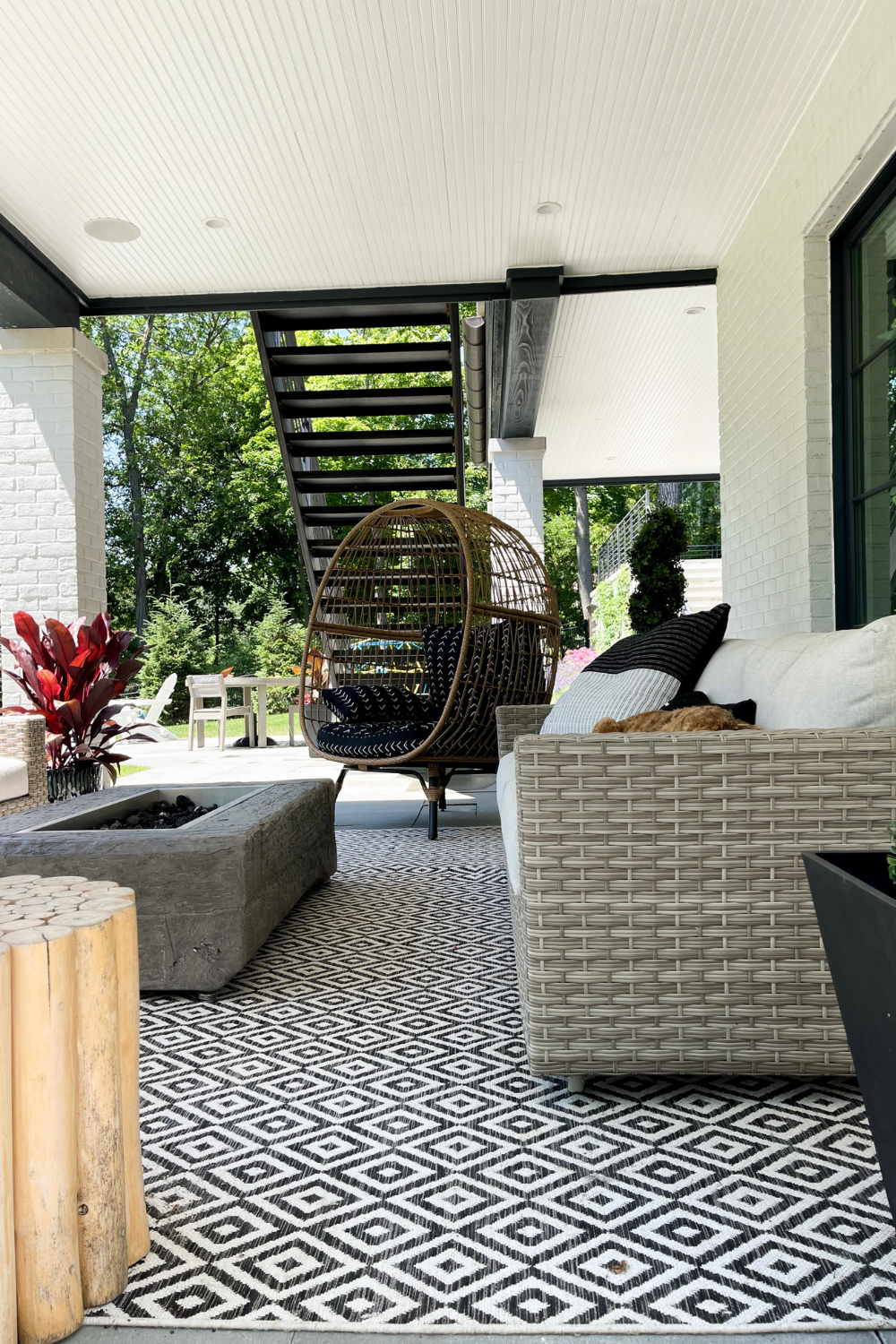 A photo of Suzanne's outdoor patio with an egg chair and wicker furniture