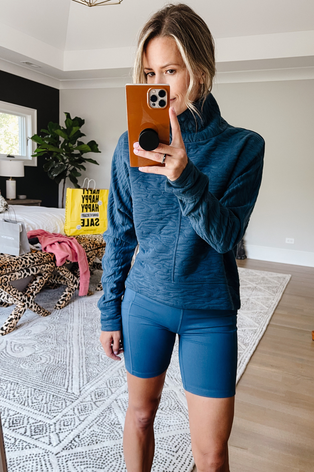 Suzanne wearing a Zella pullover and Zella bike shorts