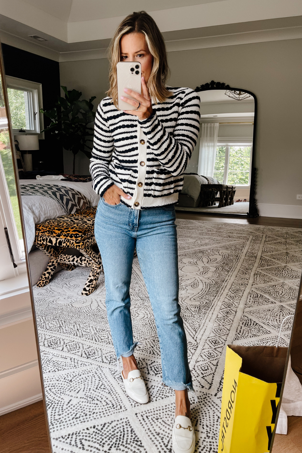 Suzanne wearing a striped cardigan and vintage straight leg denim