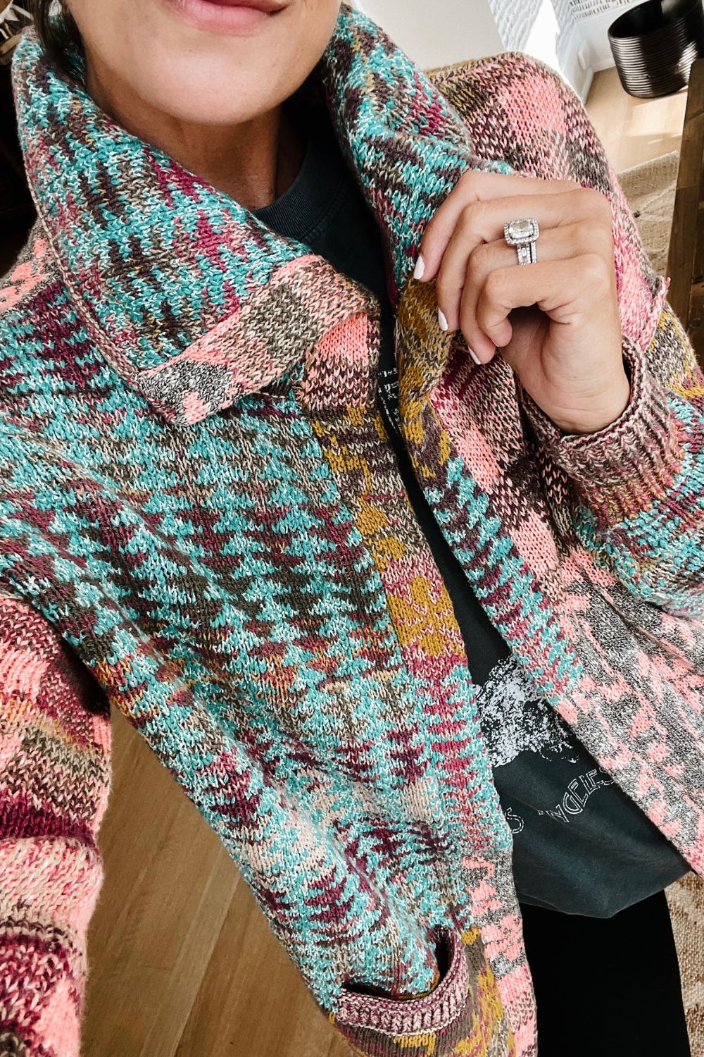 A closeup of Suzanne's Anthropologie cardigan