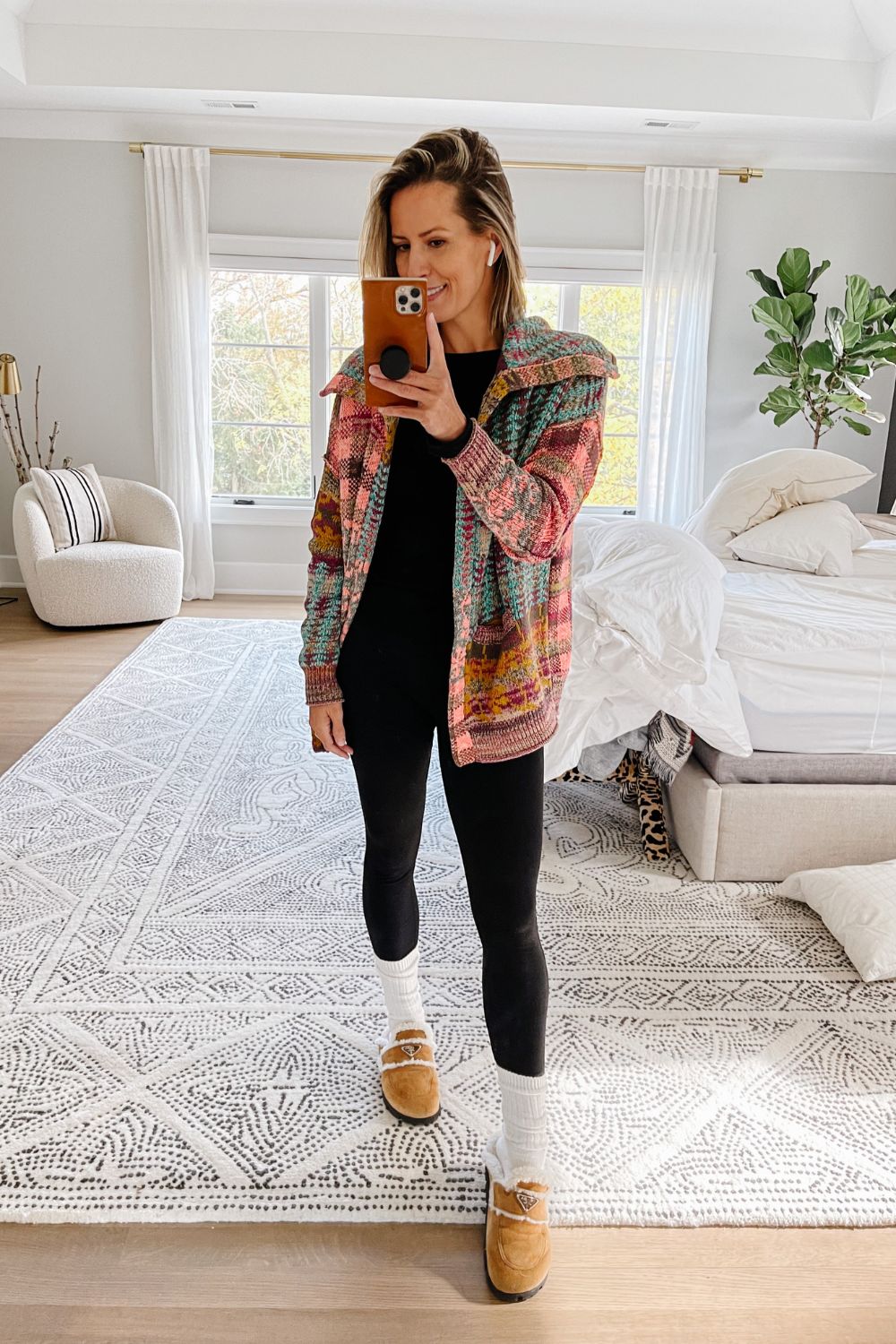Suzanne wearing an Anthropology cardigan and leggings