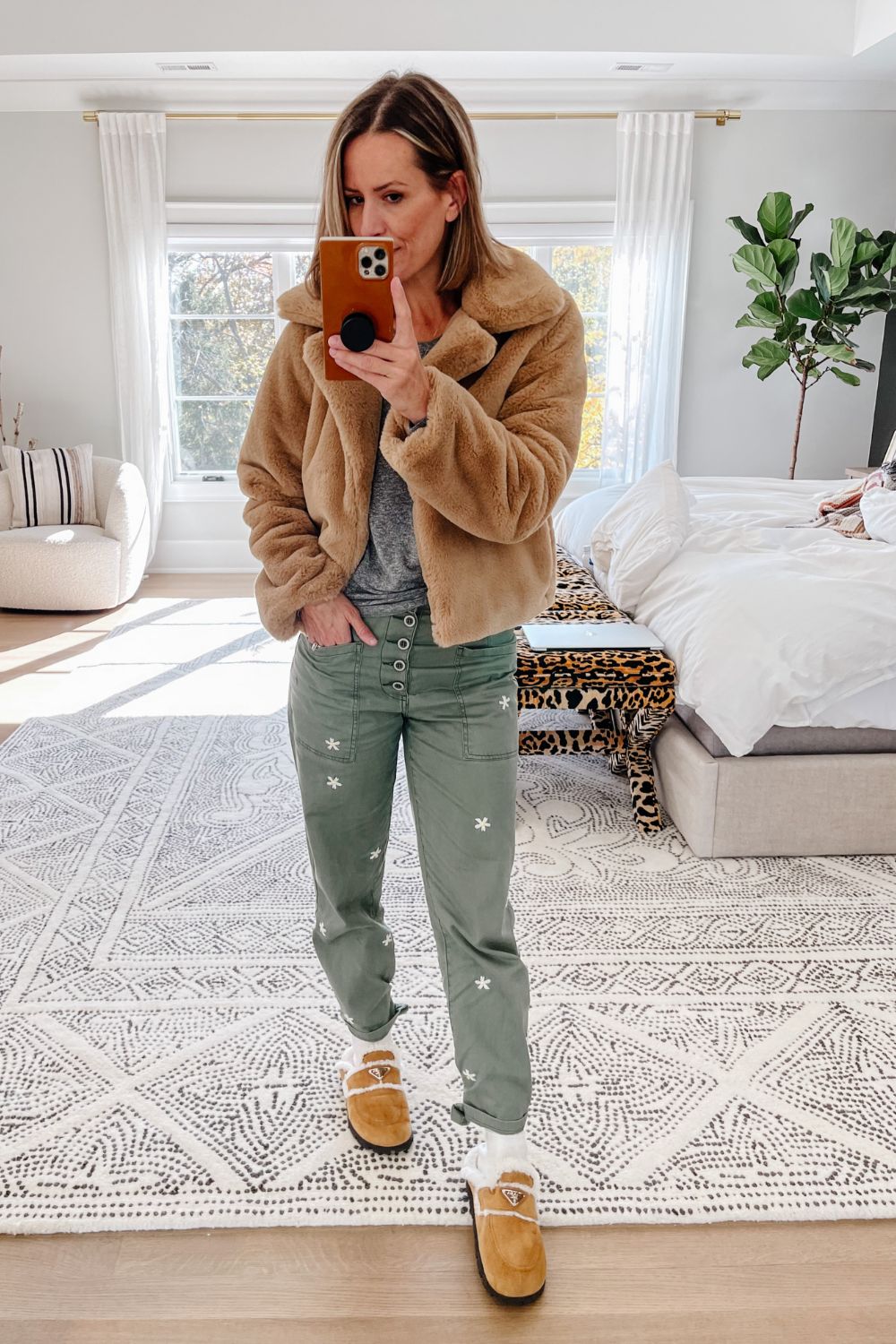 Suzanne wearing a faux fur jacket and Pistola trousers 