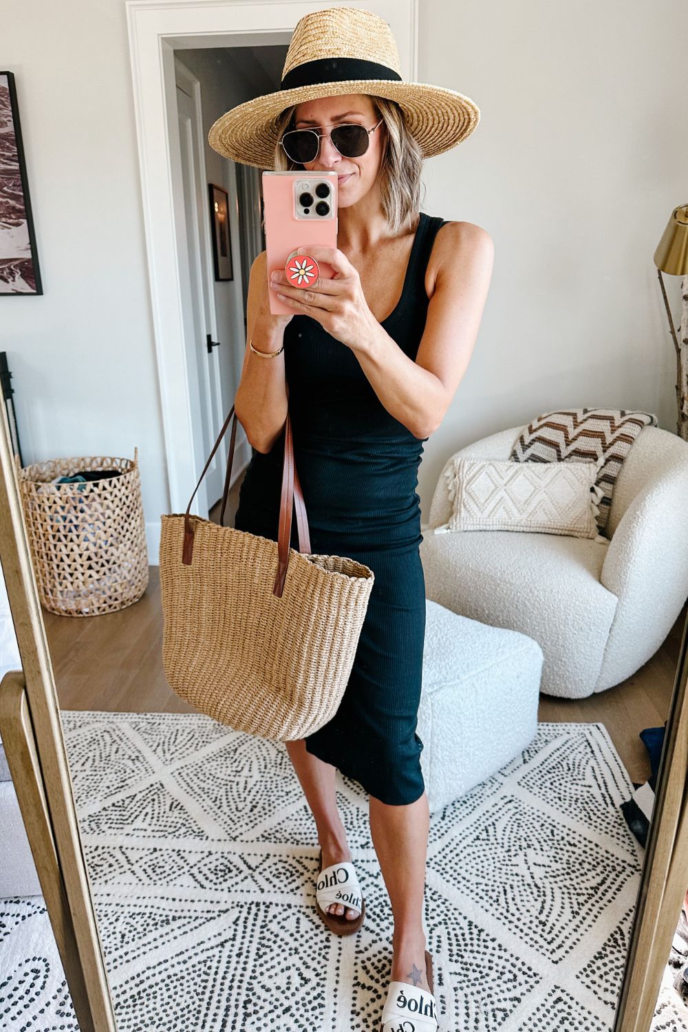 Suzanne wearing a ruched midi dress