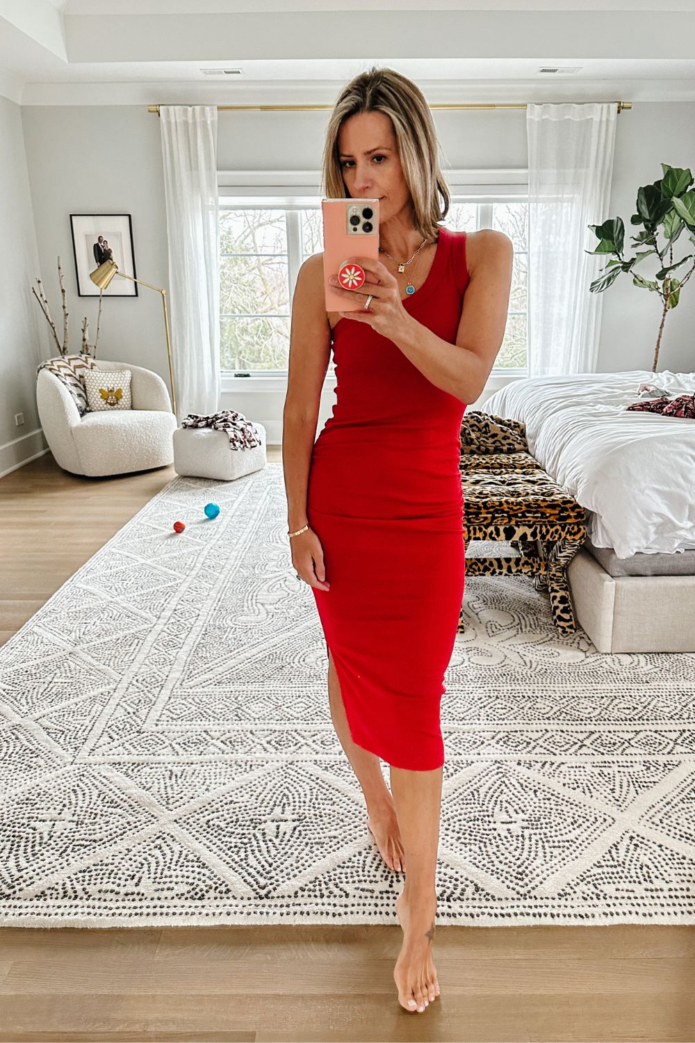 Suzanne wearing a one shoulder ribbed dress