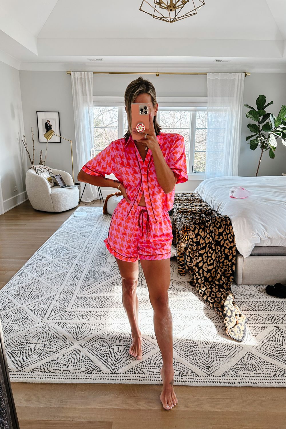 Suzanne wearing a pair of luxe satin pajamas from parade 