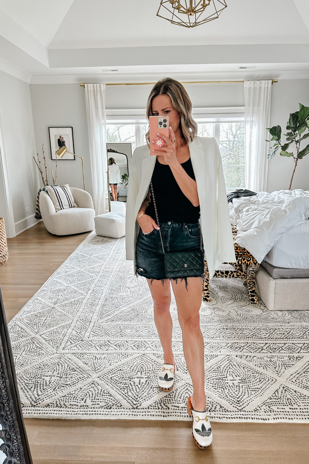 Suzanne wearing a blazer and denim shorts for date night